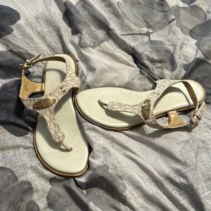 Used Michael kors sandals in excellent condition. White with gold